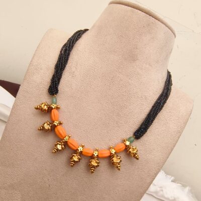 Traditional Black Beaded Multi-Strand Necklace with Peach Coral Beads & Gold-Plated Motifs