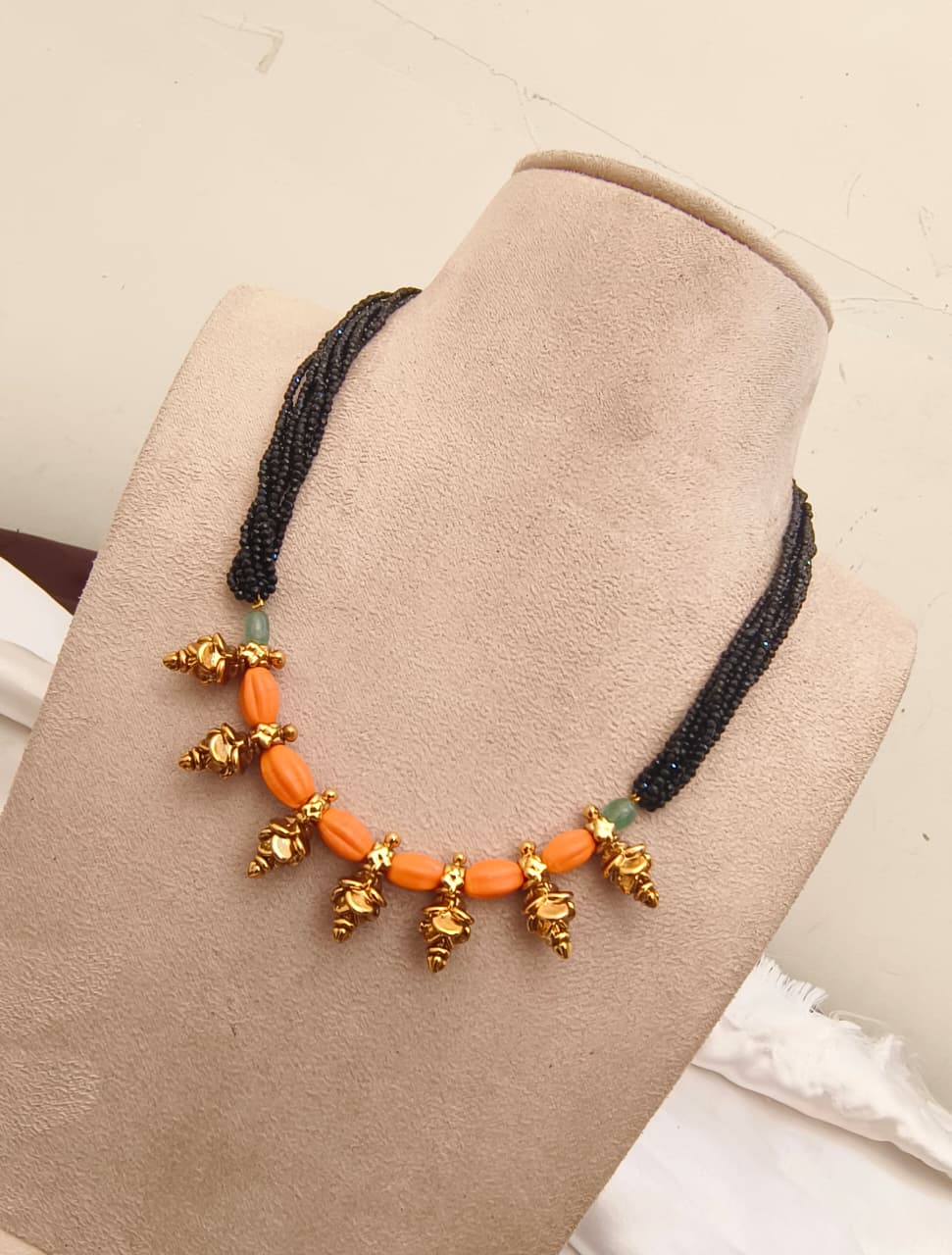Traditional Black Beaded Multi-Strand Necklace with Peach Coral Beads & Gold-Plated Motifs